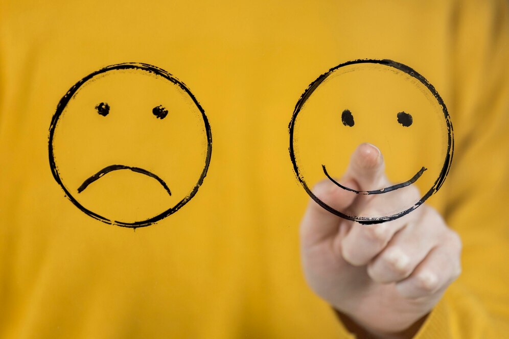 desenho de rosto feliz e triste remetendo ao transtorno bipolar
